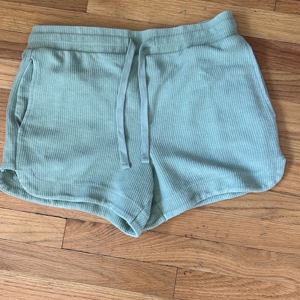 Brand new never worn thread and supply light shade of green shorts.